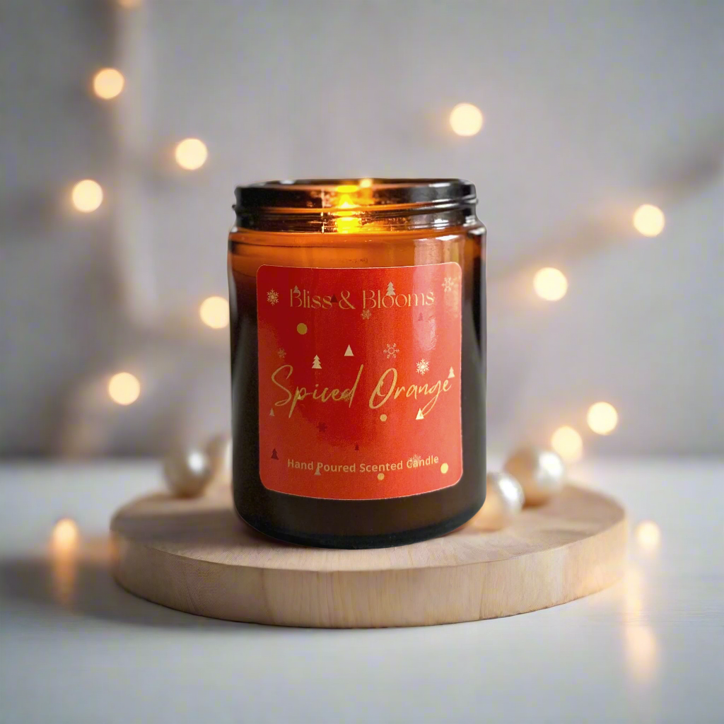 Spiced Orange Scented Candle - Embrace the festive spirit with this ultimate treat with all the magic of Christmas, a captivating blend of spiced orange, vanilla, and warm spices. The zesty sweetness of orange takes centre stage, perfectly balanced by the