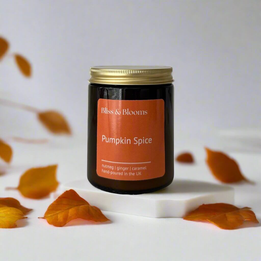 Pumpkin Spice - capturing the cosy essence of autumn. Infused with the warm, comforting aroma of freshly baked pumpkin pie, hints of nutmeg and clove. As the leaves are starting to turn golden shades of autumn this candle is the perfect way to and a touch of seasonal charm and indulge in those cosy nights in.Hand-poured using natural rapeseed & coconut wax and presented in a stylish amber glass with gold lid to lock in the fragrance. Weight: 155 g Net. Candle burn time approx *35+ hours.