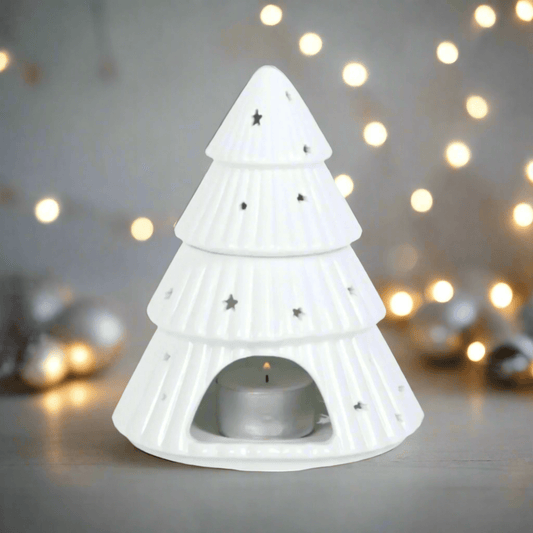 Christmas Tree Shaped Wax or Oil Burner. Add a festive touch to your home with this enchanting Christmas tree-shaped wax or oil burner. Its intricate design and classic white finish make it a captivating centerpiece to your Christmas decor.