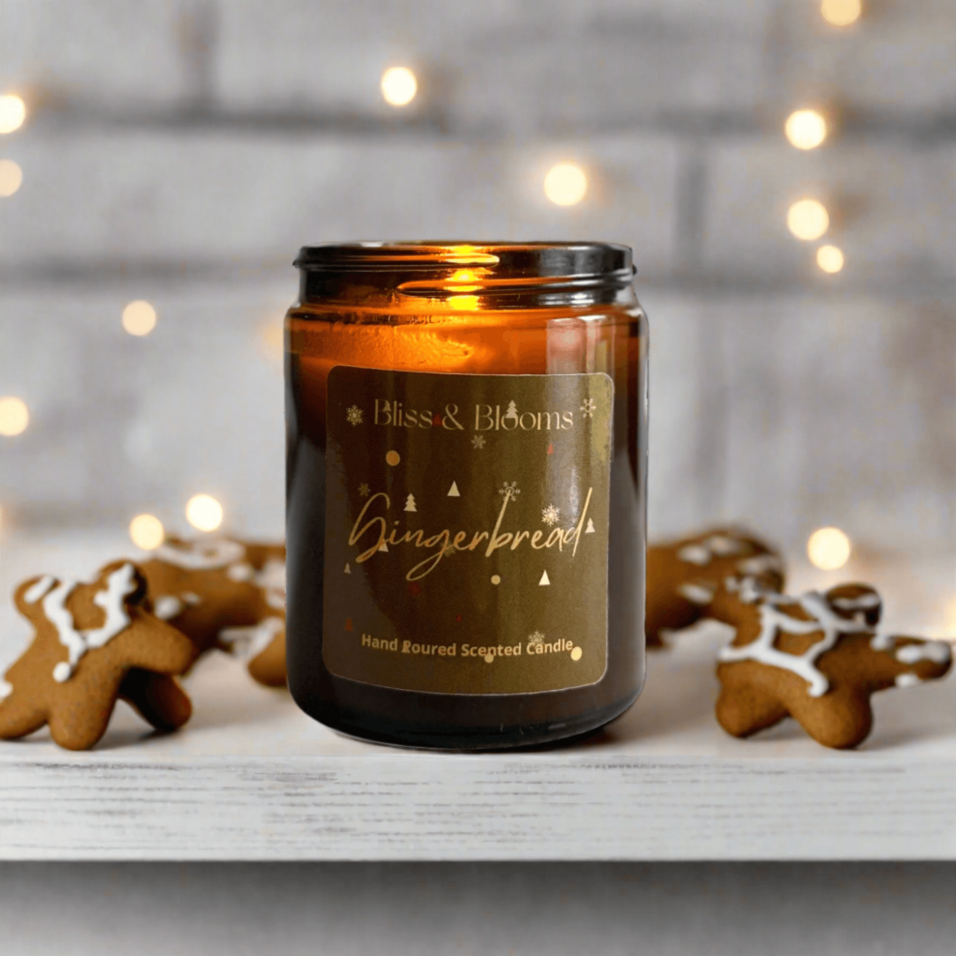 Gingerbread Scented Candle - Fill your home with the irresistible aroma of freshly baked gingerbread with this delightful candle. The warm, spicy notes of gingerbread and cinnamon are complemented by the sweet indulgence of maple syrup and caramel. A touc