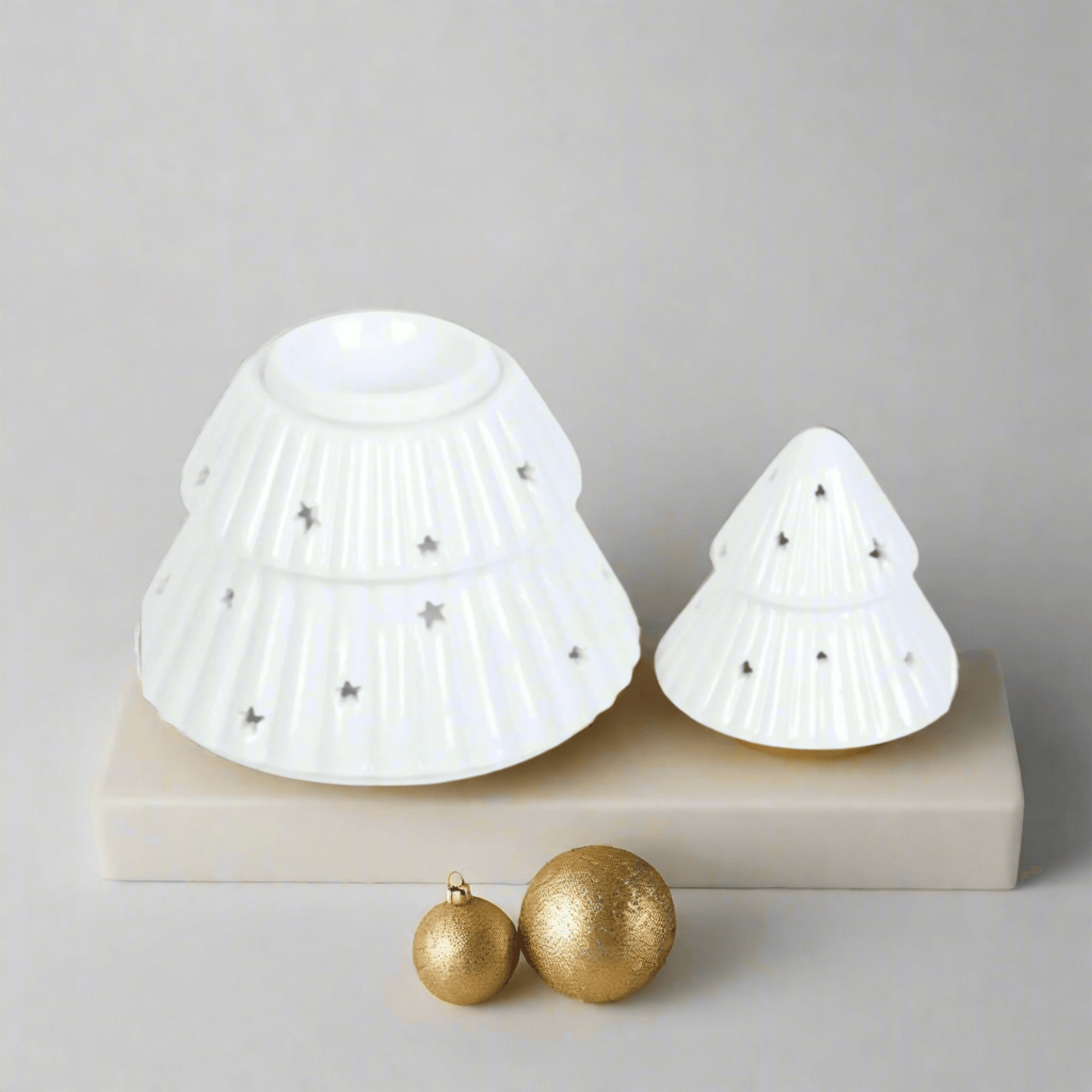 Christmas Tree Shaped Wax or Oil Burner. Add a festive touch to your home with this enchanting Christmas tree-shaped wax or oil burner. Its intricate design and classic white finish make it a captivating centerpiece to your Christmas decor.